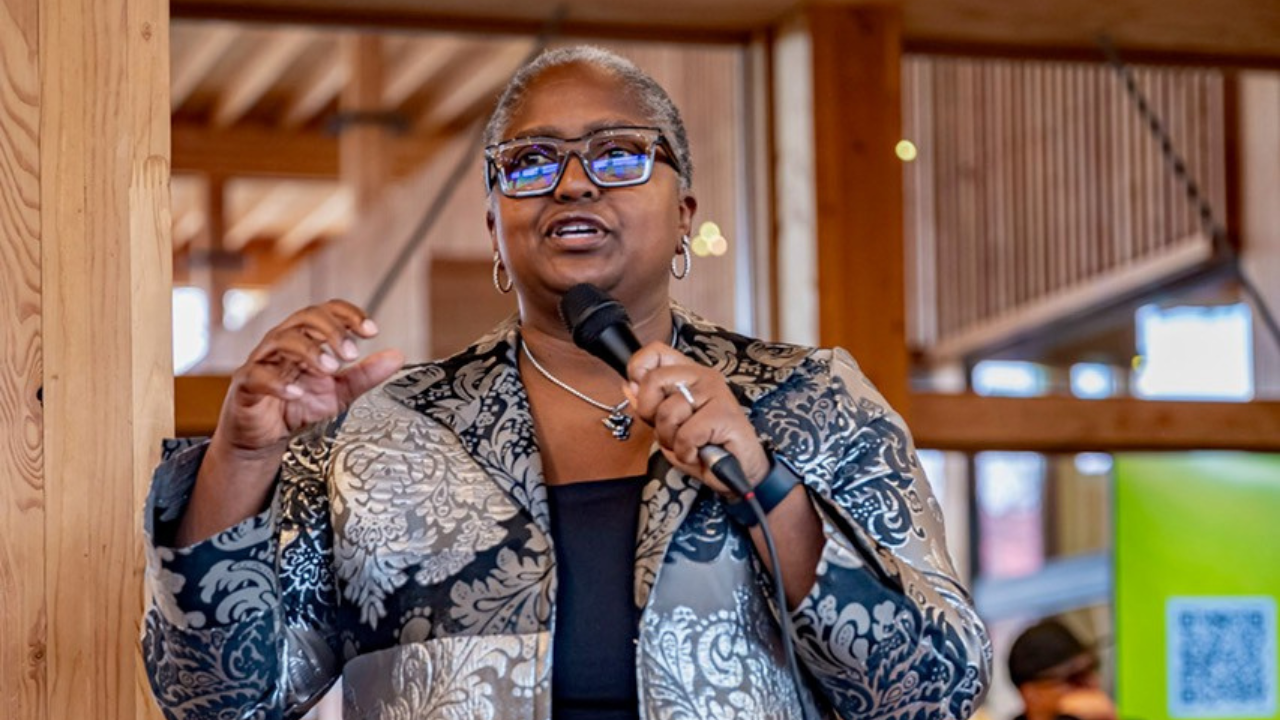 Monica Ray speaking at an event